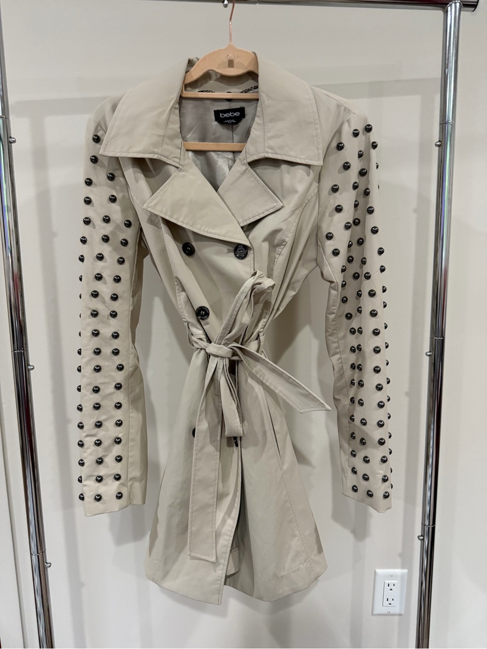 Bebe nude trench coat with gun metal studs on the sleeves size medium